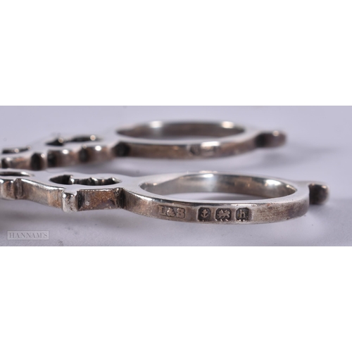 892 - THREE PAIRS OF ANTIQUE SILVER SUGAR TONGS. 80 grams. 9.5 cm long. (3)