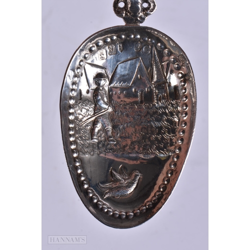 895 - A PAIR OF ANTIQUE DUTCH SILVER REPOUSSE SPOONS with London import marks. 118 grams. 17 cm long.