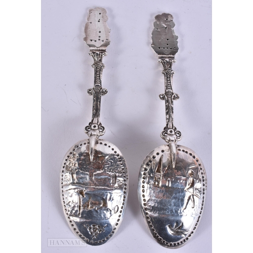 895 - A PAIR OF ANTIQUE DUTCH SILVER REPOUSSE SPOONS with London import marks. 118 grams. 17 cm long.