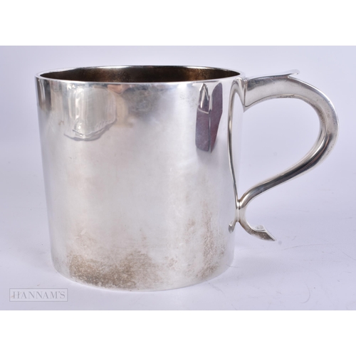 905 - AN ANTIQUE SILVER MUG together with a boxed silver napkin ring. 248 grams. Largest 8 cm x 12 cm. (2)