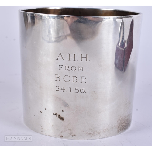 905 - AN ANTIQUE SILVER MUG together with a boxed silver napkin ring. 248 grams. Largest 8 cm x 12 cm. (2)