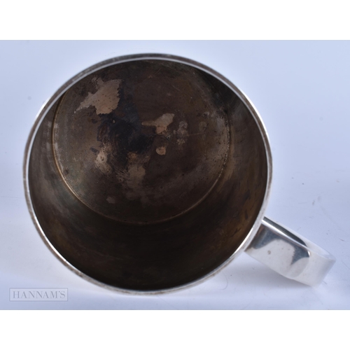 905 - AN ANTIQUE SILVER MUG together with a boxed silver napkin ring. 248 grams. Largest 8 cm x 12 cm. (2)