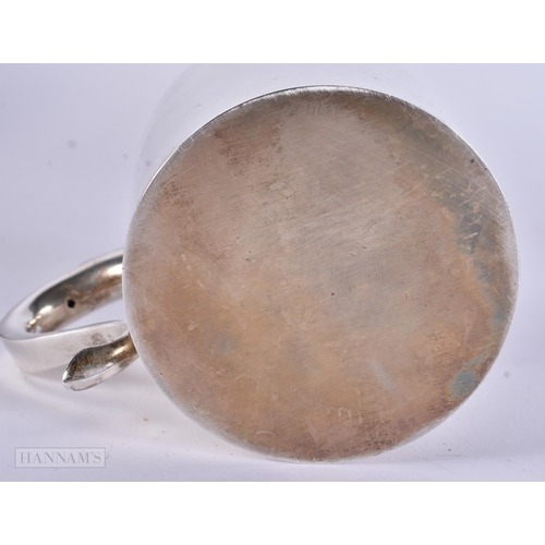 905 - AN ANTIQUE SILVER MUG together with a boxed silver napkin ring. 248 grams. Largest 8 cm x 12 cm. (2)