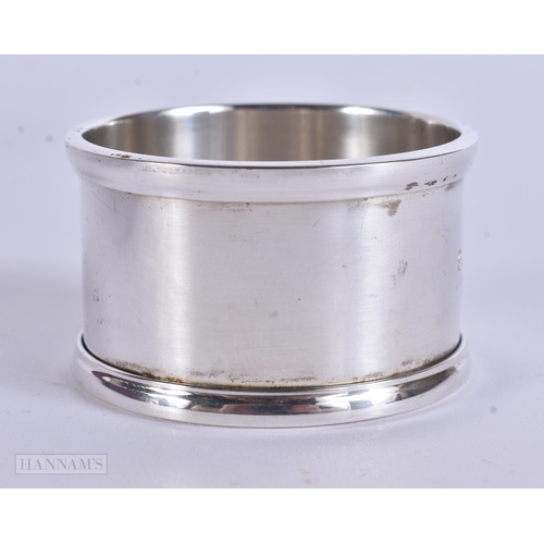 905 - AN ANTIQUE SILVER MUG together with a boxed silver napkin ring. 248 grams. Largest 8 cm x 12 cm. (2)