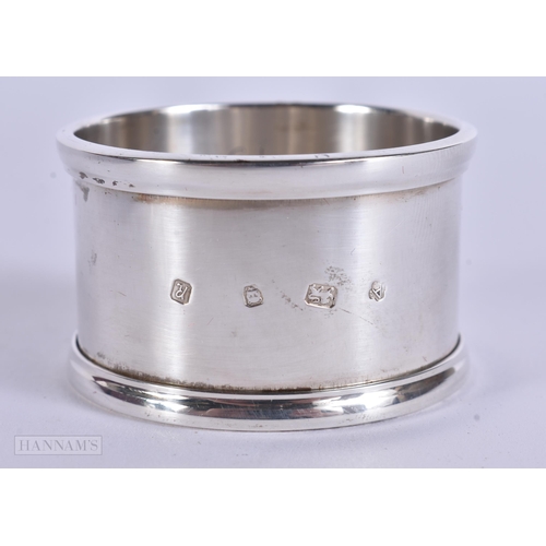 905 - AN ANTIQUE SILVER MUG together with a boxed silver napkin ring. 248 grams. Largest 8 cm x 12 cm. (2)