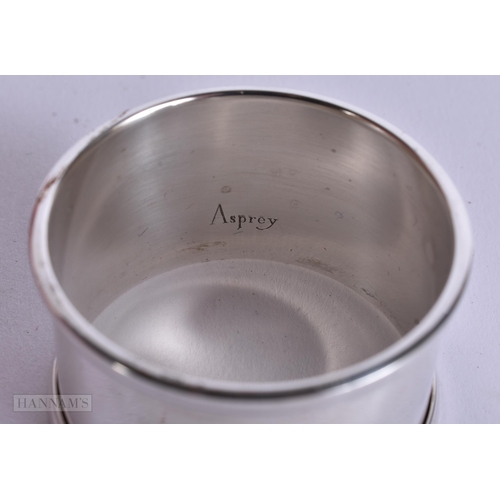905 - AN ANTIQUE SILVER MUG together with a boxed silver napkin ring. 248 grams. Largest 8 cm x 12 cm. (2)