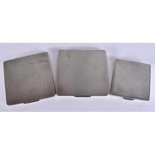906 - THREE ART DECO SILVER COMPACTS. 399 grams. Largest 9 cm square. (3)