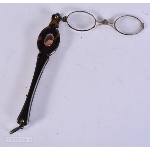 911 - A PAIR OF TORTOISESHELL LORGNETTES. 18 cm long extended.
