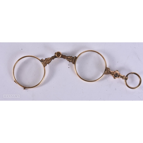 912 - A PAIR OF ANTIQUE YELLOW METAL LORGNETTES. 12 cm long extended.