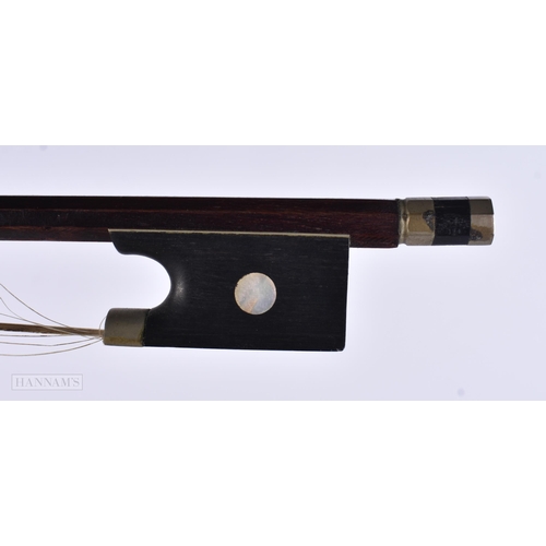 914 - A VIOLIN together with two wall brackets. (3)
