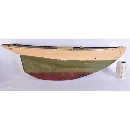 916 - A LARGE VINTAGE PAINTED WOOD SHIPS HULL. 78 cm x 30 cm.