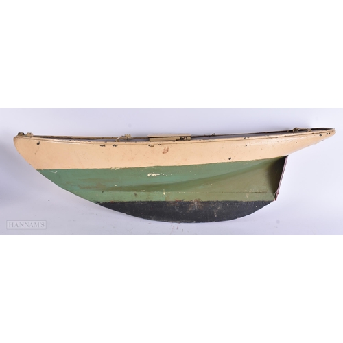 916 - A LARGE VINTAGE PAINTED WOOD SHIPS HULL. 78 cm x 30 cm.