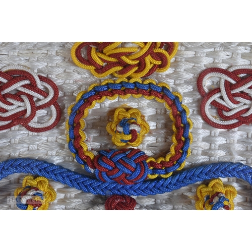 920 - A LARGE SAILORS MARITIME EMBROIDERED KNOT DISPLAY. 66 cm x 56 cm.