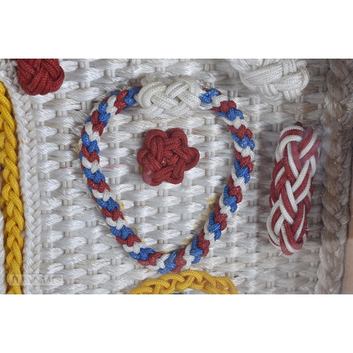 920 - A LARGE SAILORS MARITIME EMBROIDERED KNOT DISPLAY. 66 cm x 56 cm.