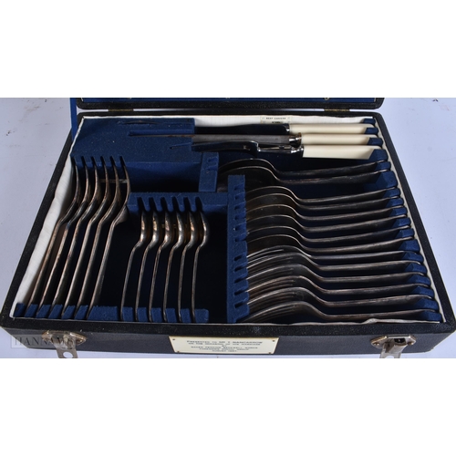 923 - A LARGE ANTIQUE WARMING PAN together with a canteen of cutlery. Largest 120 cm long. (2)