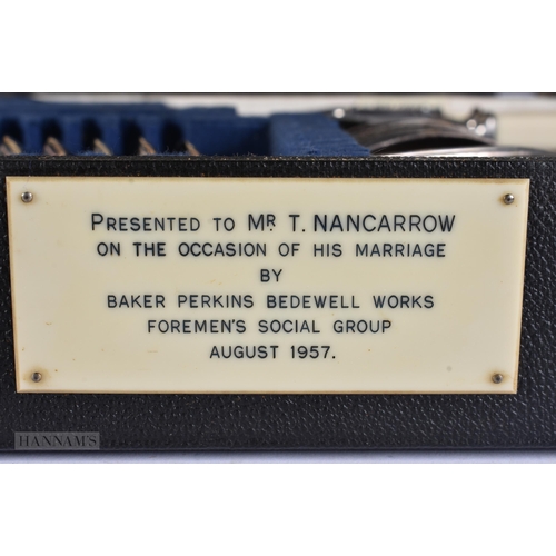 923 - A LARGE ANTIQUE WARMING PAN together with a canteen of cutlery. Largest 120 cm long. (2)