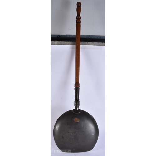 923 - A LARGE ANTIQUE WARMING PAN together with a canteen of cutlery. Largest 120 cm long. (2)