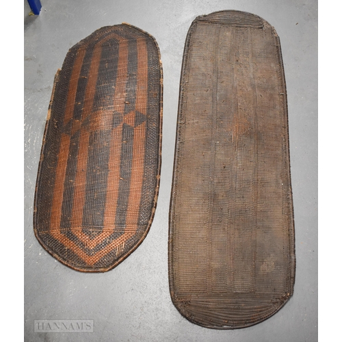 925 - TWO LARGE AFRICAN TRIBAL SHIELDS. Largest 140 cm x 45 cm. (2)