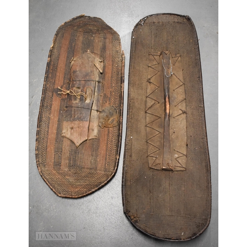 925 - TWO LARGE AFRICAN TRIBAL SHIELDS. Largest 140 cm x 45 cm. (2)
