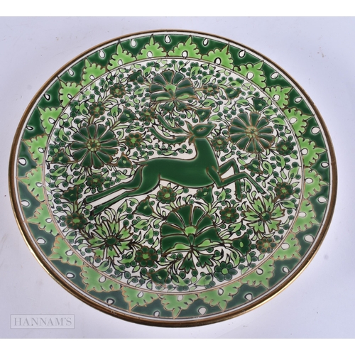 928 - AN ART DECO KERAMIK ENAMELLED POTTERY DEER DISH. 24 cm diameter.