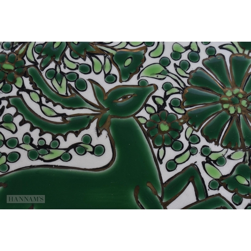 928 - AN ART DECO KERAMIK ENAMELLED POTTERY DEER DISH. 24 cm diameter.