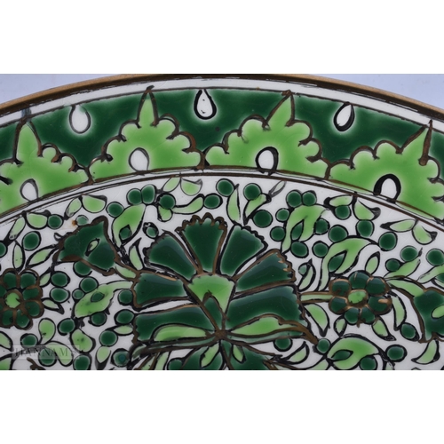 928 - AN ART DECO KERAMIK ENAMELLED POTTERY DEER DISH. 24 cm diameter.