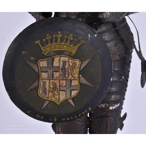 930 - A MINIATURE SUIT OF ARMOUR. 28 cm high.