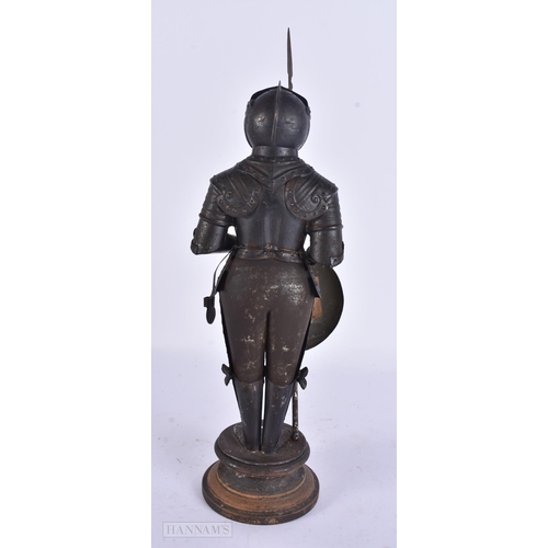 930 - A MINIATURE SUIT OF ARMOUR. 28 cm high.