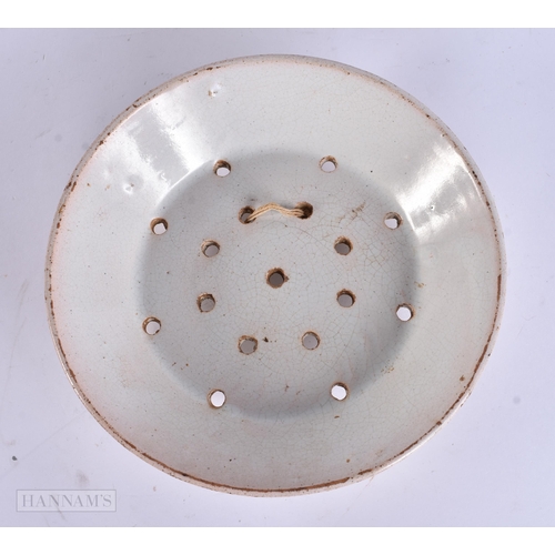 931 - TWO ANTIQUE POTTERY STRAINING DISHES. Largest 23 cm diameter. (2)
