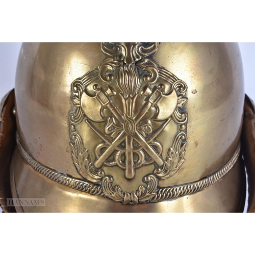 936 - A BRASS FIREMANS HELMET. 28 cm x 24 cm.