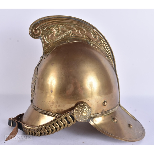 936 - A BRASS FIREMANS HELMET. 28 cm x 24 cm.