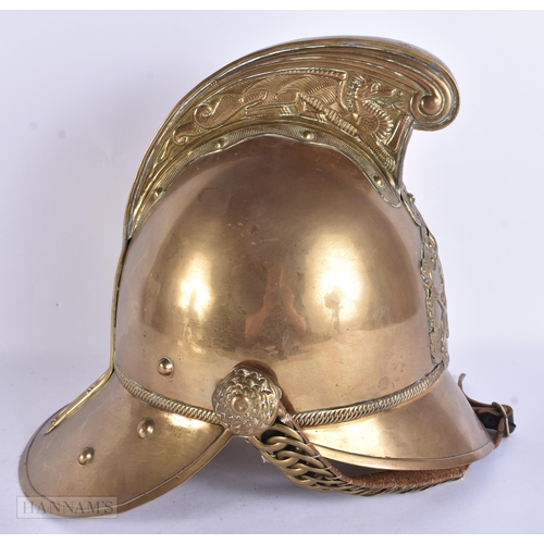 936 - A BRASS FIREMANS HELMET. 28 cm x 24 cm.