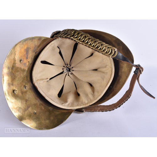 936 - A BRASS FIREMANS HELMET. 28 cm x 24 cm.