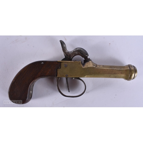 938 - A VERY RARE ANTIQUE CAST IRON PISTOL TRAP together with a smaller antique pistol. Largest 18 cm wide... 