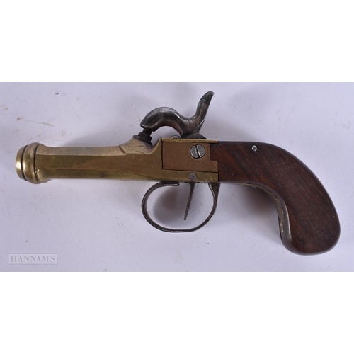 938 - A VERY RARE ANTIQUE CAST IRON PISTOL TRAP together with a smaller antique pistol. Largest 18 cm wide... 