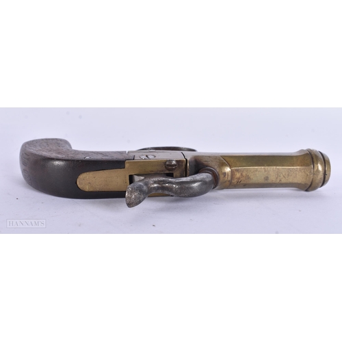 938 - A VERY RARE ANTIQUE CAST IRON PISTOL TRAP together with a smaller antique pistol. Largest 18 cm wide... 