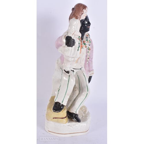 944 - A VICTORIAN STAFFORDSHIRE UNCLE TOM FIGURE. 27 cm high.