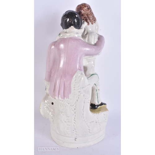 944 - A VICTORIAN STAFFORDSHIRE UNCLE TOM FIGURE. 27 cm high.