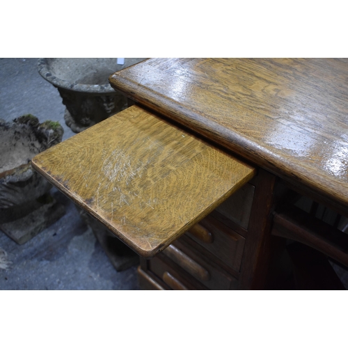 3996 - A substantial vintage oak Partners desk by Shannon 89 x 151 x 121cm