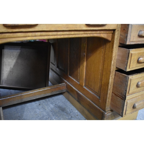 3996 - A substantial vintage oak Partners desk by Shannon 89 x 151 x 121cm