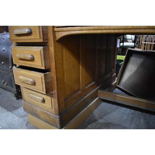 3996 - A substantial vintage oak Partners desk by Shannon 89 x 151 x 121cm