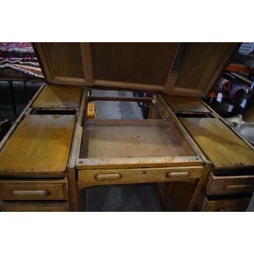 3996 - A substantial vintage oak Partners desk by Shannon 89 x 151 x 121cm