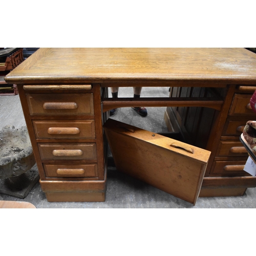 3996 - A substantial vintage oak Partners desk by Shannon 89 x 151 x 121cm