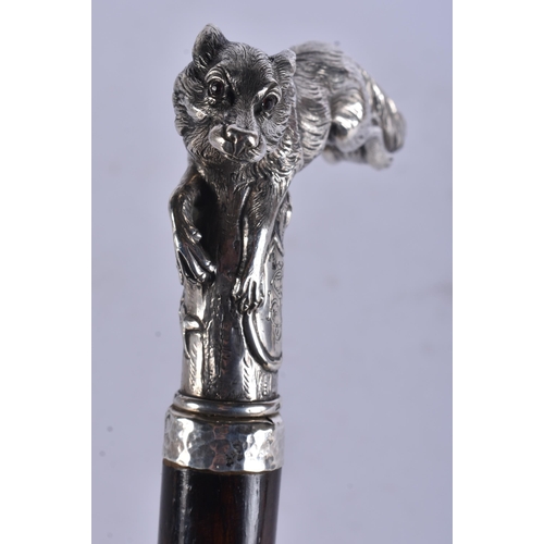 243 - AN ANTIQUE SOLID SILVER RUBY EYED FOX WALKING CANE. 95 cm long.