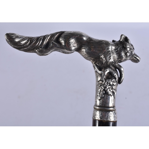 243 - AN ANTIQUE SOLID SILVER RUBY EYED FOX WALKING CANE. 95 cm long.