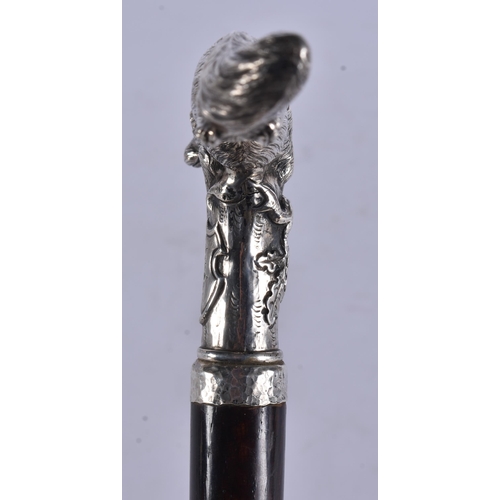 243 - AN ANTIQUE SOLID SILVER RUBY EYED FOX WALKING CANE. 95 cm long.