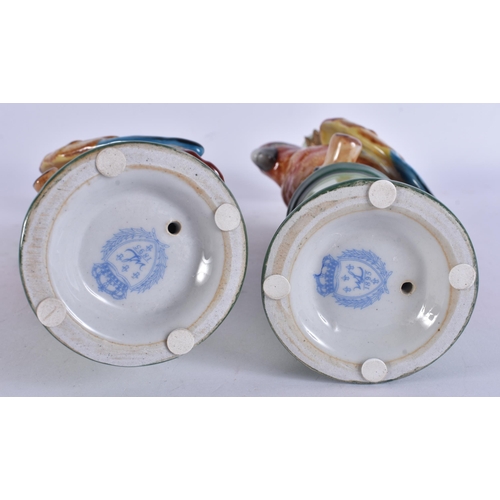 263 - A PAIR OF PARROT POTTERY CANDLESTICKS. 29 cm high.