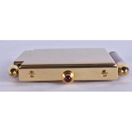 268 - A CARTIER MAROON ENAMELLED STRUT CLOCK. 6.75 cm x 5 cm.