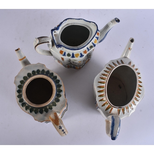 269 - THREE 18TH/19TH CENTURY PAINTED PEARLWARE TEAPOTS. Largest 20 cm wide. (3)