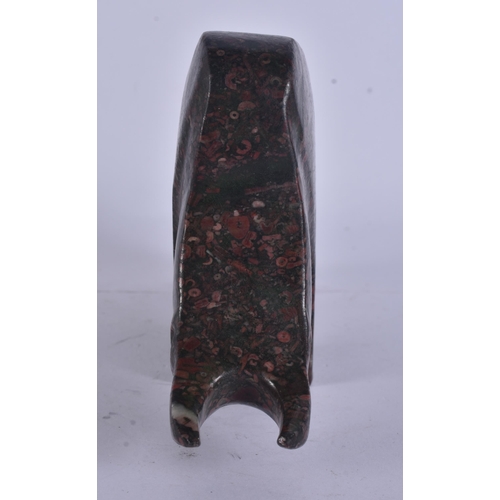 271 - A STYLISH PUDDINGSTONE CARVED ABSTRACT FIGURE OF A BULL. 17 cm wide.